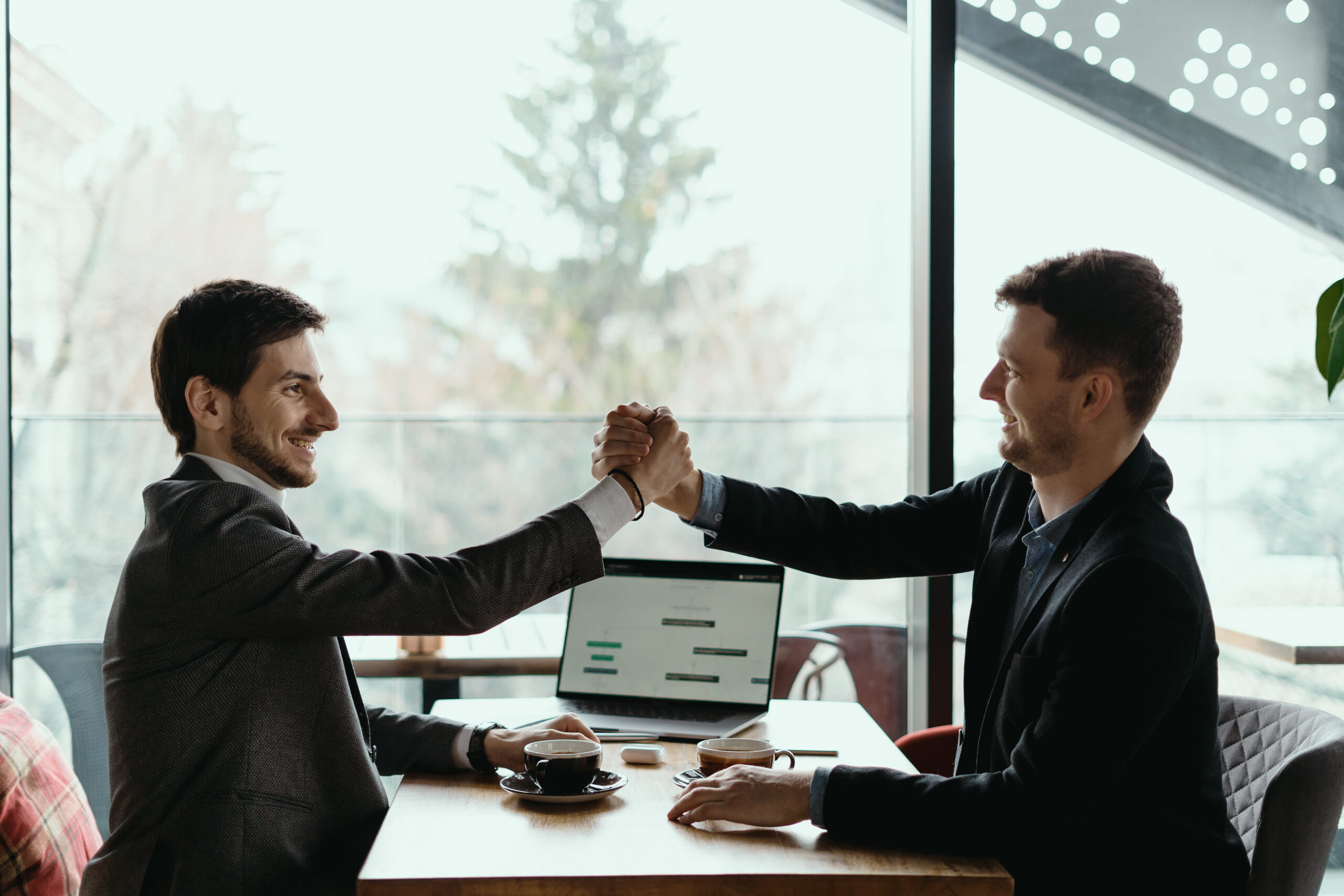 two business men celebrating a deal